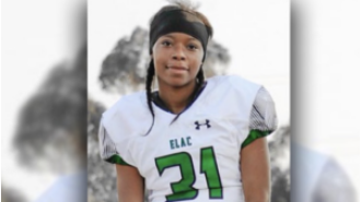 A female athlete has become the first to receive a 4-year college football scholarship.