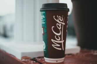 Man arrested for allegedly throwing hot coffee at McDonald's drive-thru employee.