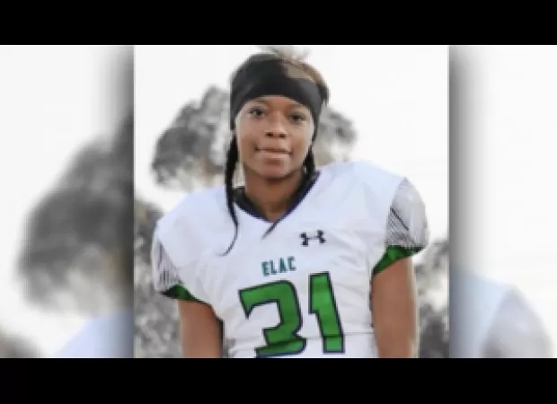 A female athlete has become the first to receive a 4-year college football scholarship.