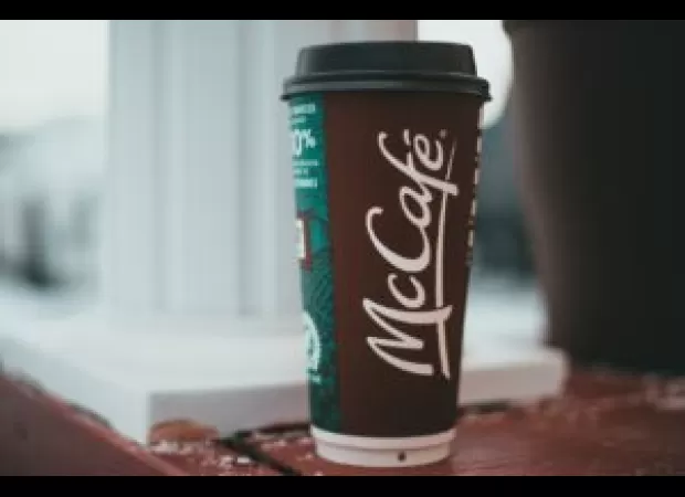 Man arrested for allegedly throwing hot coffee at McDonald's drive-thru employee.