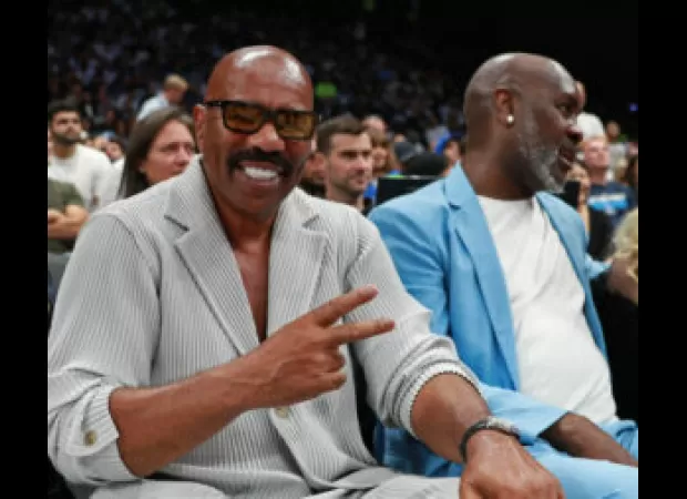 Michael B. Jordan and Steve Harvey embraced at an NBA game, a year after Michael's breakup with Lori Harvey.