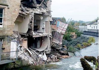 Former courthouse, listed as a Grade II building, has collapsed into a river, becoming an iconic image.
