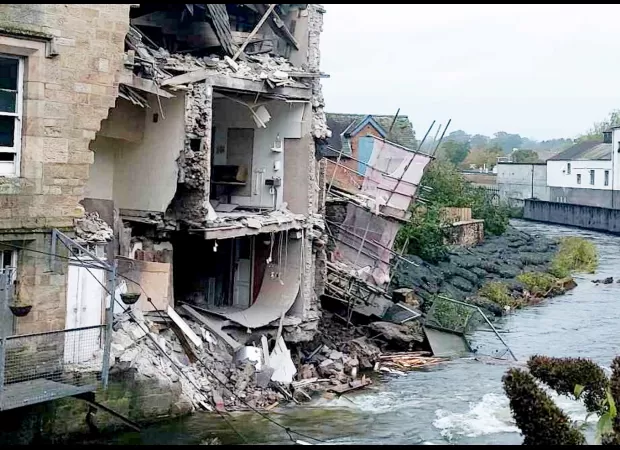 Former courthouse, listed as a Grade II building, has collapsed into a river, becoming an iconic image.