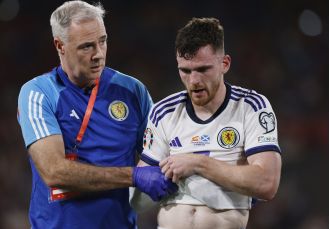 Robertson injured during Scotland game, causing worry for Liverpool as he is forced off.