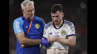 Robertson injured during Scotland game, causing worry for Liverpool as he is forced off.