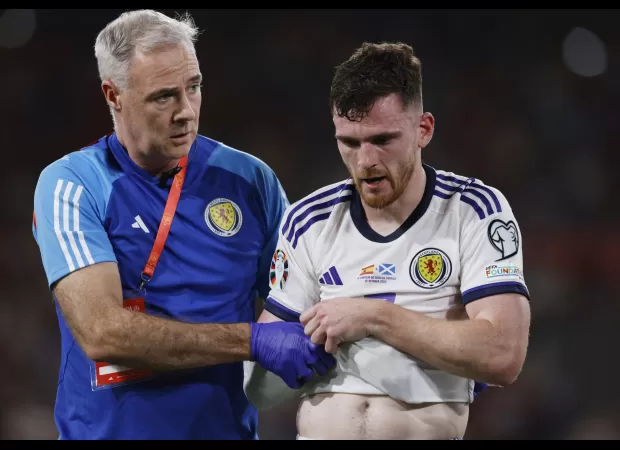 Robertson injured during Scotland game, causing worry for Liverpool as he is forced off.