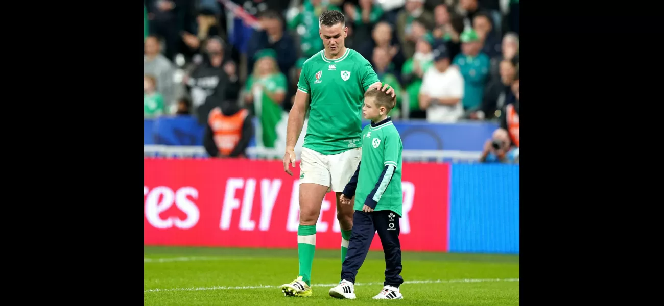 Johnny Sexton embraces his son in a tender moment after Ireland's heartbreaking exit from the Rugby World Cup.
