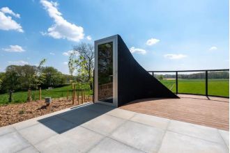 Futuristic door opens to an amazing Airbnb space.