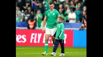 Johnny Sexton embraces his son in a tender moment after Ireland's heartbreaking exit from the Rugby World Cup.