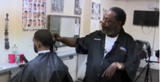 60-year-old black barber with only one functioning arm inspiring others with his resilience and determination.
