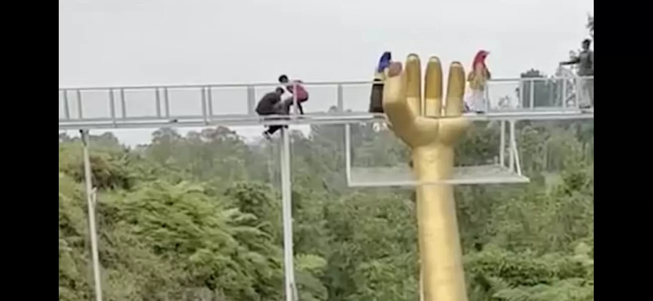 Tourist dies after walking on 30ft-high glass walkway which suddenly shatters.