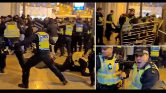 Brighton & Ajax fans clashed violently, resulting in a police officer being knocked down.