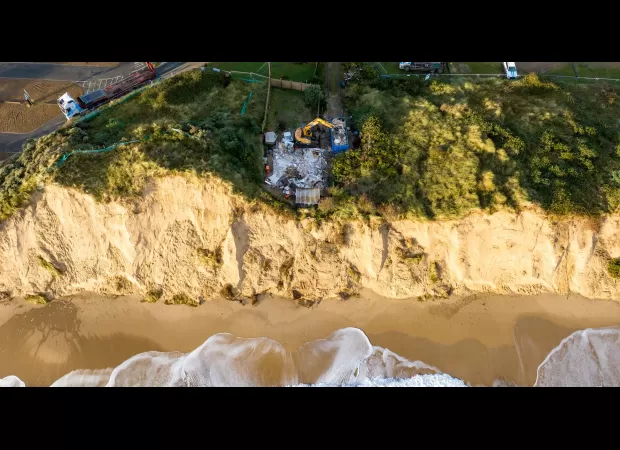 The last house on the cliff was destroyed, while the others were swept away by the sea.