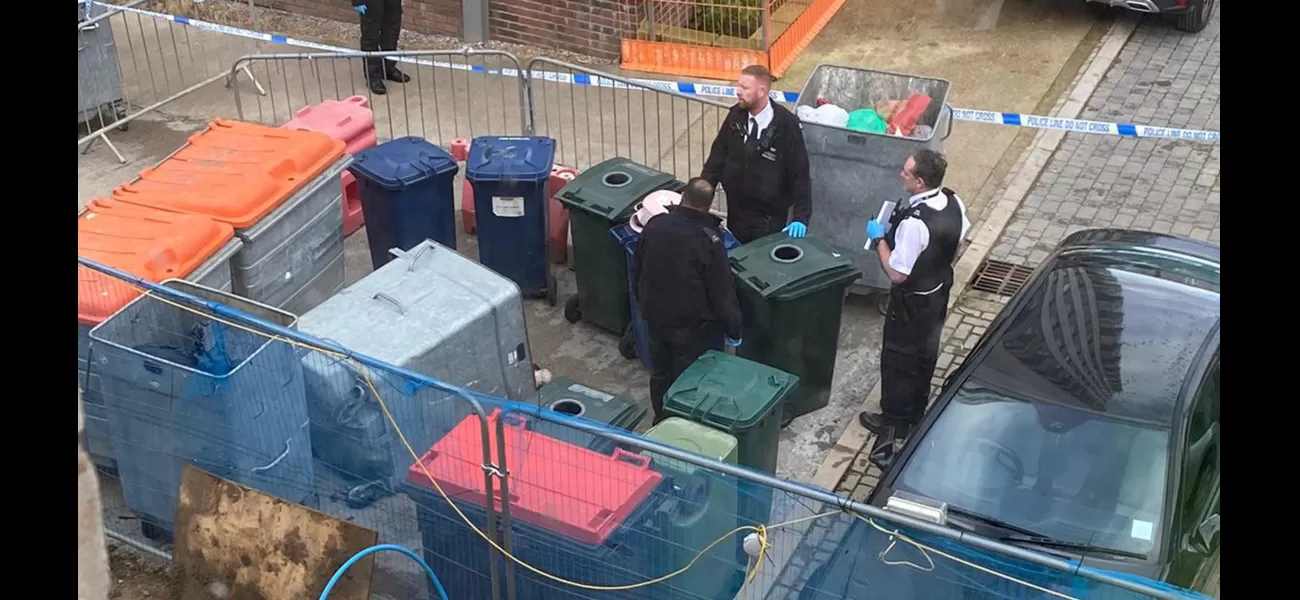 Body of woman discovered in large plastic container with wheels.