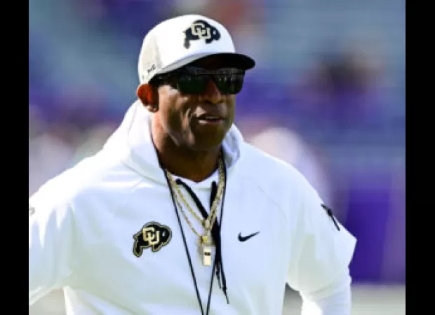 Deion Sanders sets Guinness World Record with a massive football lesson to aspiring coaches.