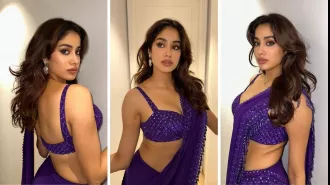 Janhvi Kapoor looks stunning in a deep purple saree, exuding classic Bollywood beauty vibes.