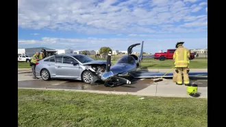 A small plane crashed into a car after failing to land on the runway.
