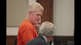 Ex-lawyer gets plea deal for 101 financial crimes after murdering wife and son; smirks in court.