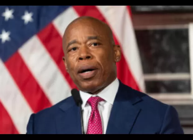 Eric Adams establishes legal defense fund as second aide's home is searched by authorities.