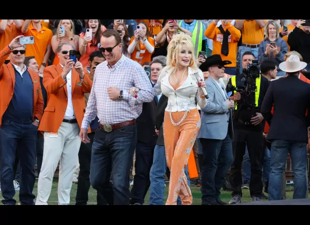 Dolly Parton and an NFL legend strolled together at a college football game.