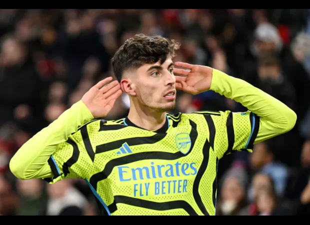 Arsenal go to the top of the Premier League table with a thrilling late victory over Brentford.