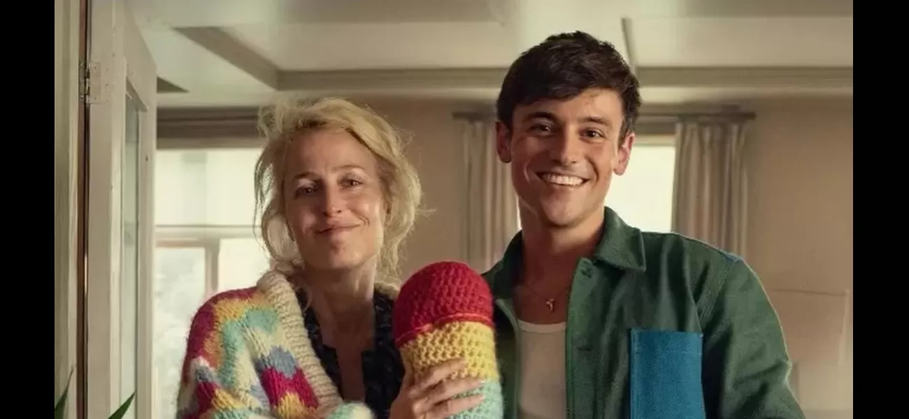 Gillian Anderson proudly displays a large, crochet NSFW gift from Tom Daley.