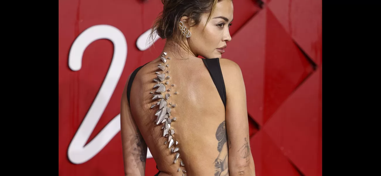 Rita Ora made a bold statement with her prosthetic look at the Fashion Awards, likened to Godzilla.