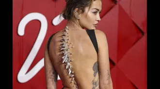 Rita Ora made a bold statement with her prosthetic look at the Fashion Awards, likened to Godzilla.