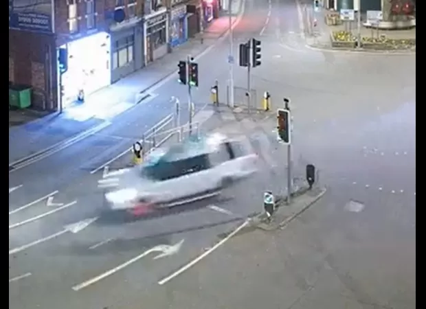 Driver crashed a stolen car into a pub after a high-speed chase, narrowly missing customers inside.