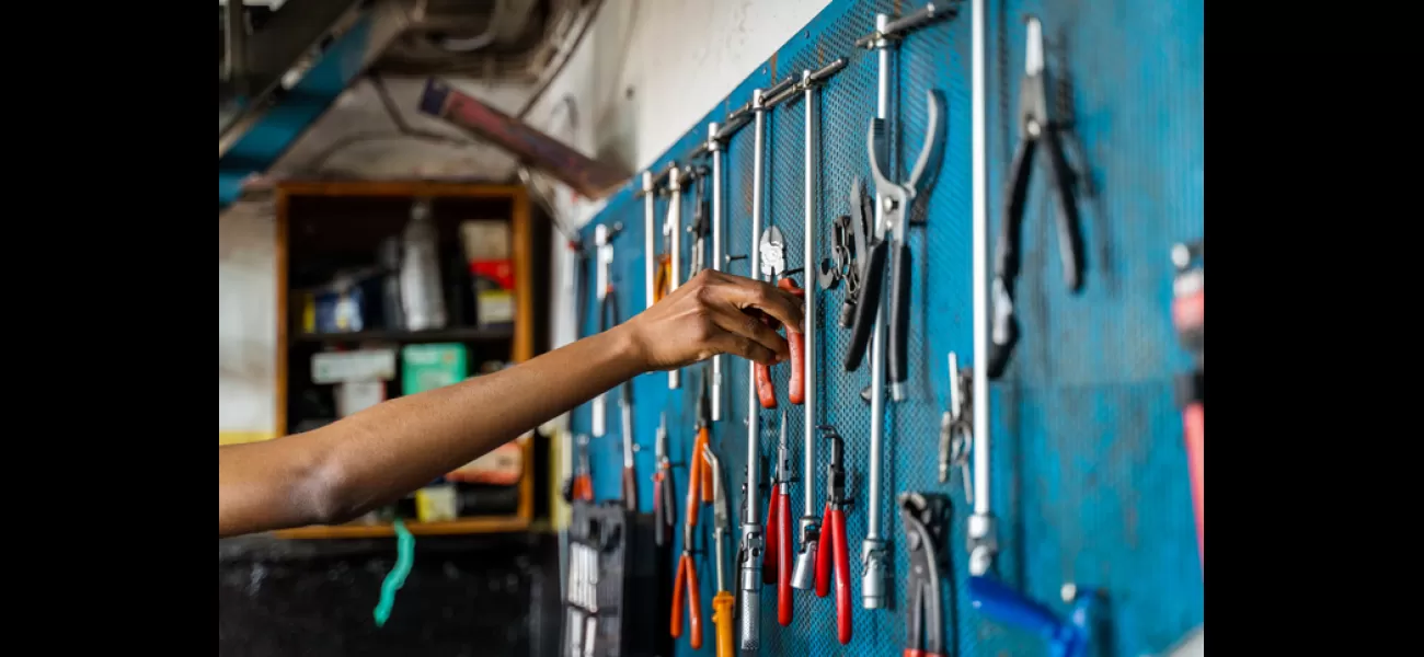 11-year-old black girl in Ghana repairs motorcycles as a mechanic.
