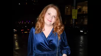 Jennie McAlpine smiling excitedly at soap reunion.