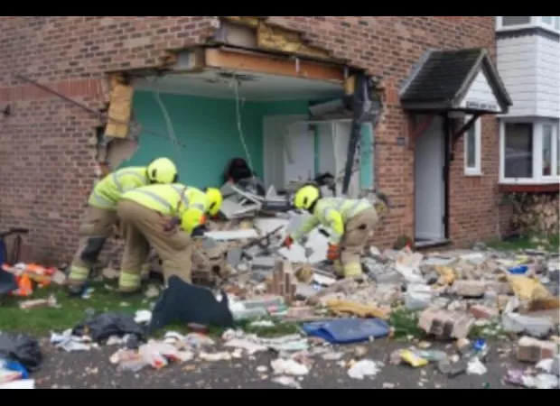 Car crashes into side of house at 80mph, leaving a huge hole on Christmas Day.