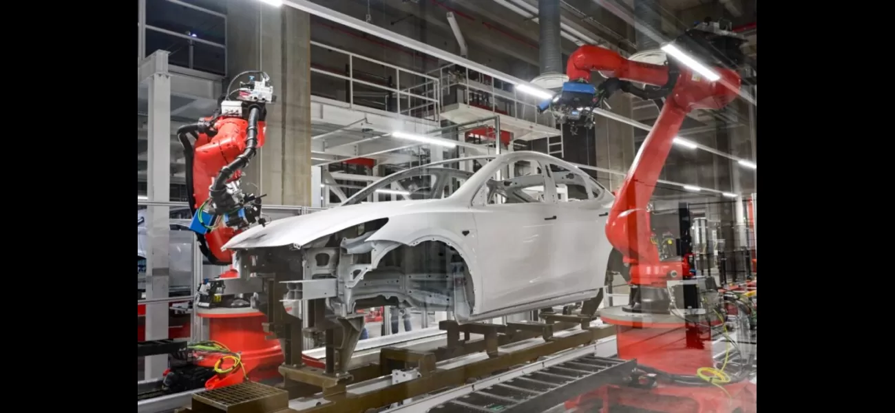 Engineer attacked by robot while working in Tesla car factory.