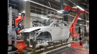 Engineer attacked by robot while working in Tesla car factory.