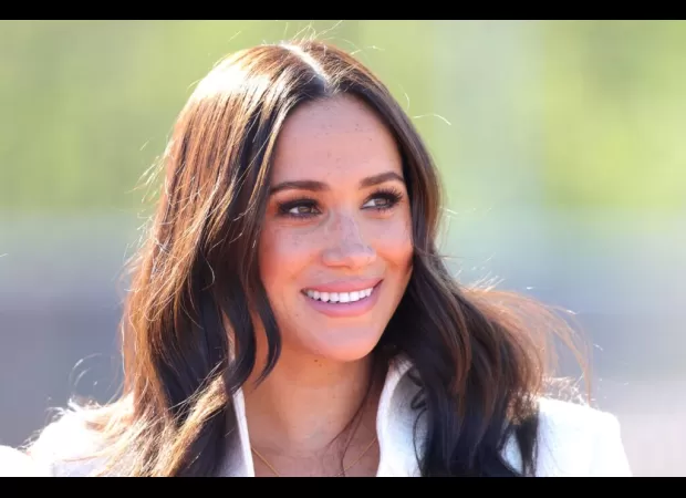 Meghan Markle returns to the screen as an extra in an advertisement for a latte brand she has invested in.
