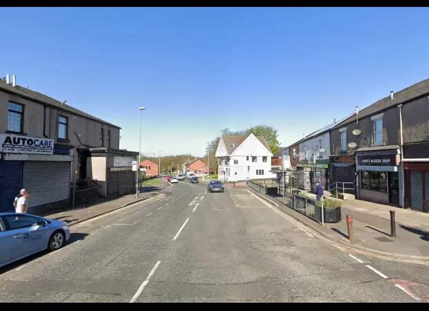 Teenager killed in car crash after vehicle veers off road and hits building.