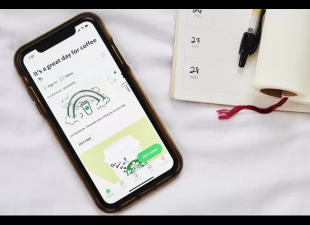 Starbucks accused of deceiving customers with app, collecting $900M over 5 years.
