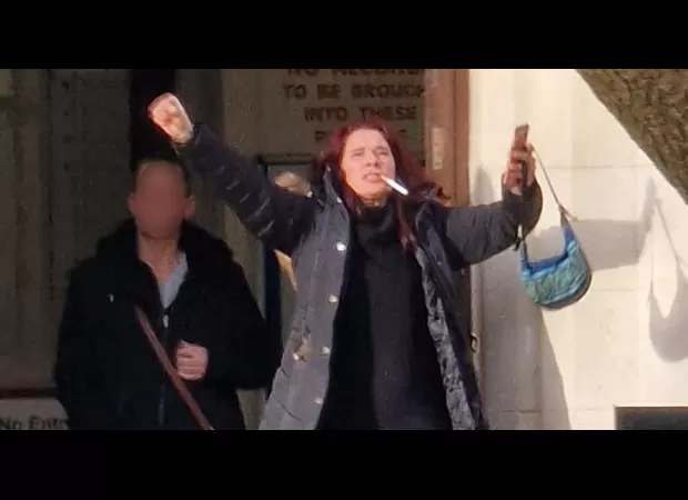 Neighbour from hell leaves court smoking a cigarette, shouting 