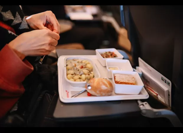 Airline crew member explains food preparation process on flights.