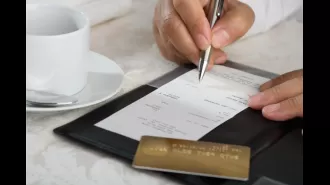 Controversy over Atlanta eatery's 4% health insurance surcharge for customers to assist employees.