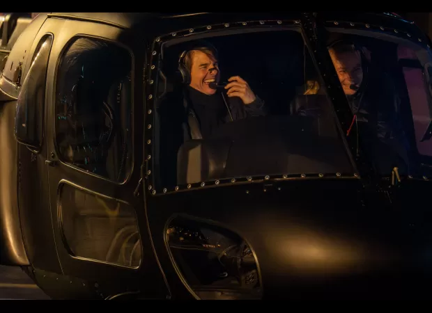 Tom Cruise impressively lands helicopter in London using his aviation expertise.