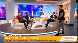 A WWE wrestler gets angry during an interview and threatens to punch the host.