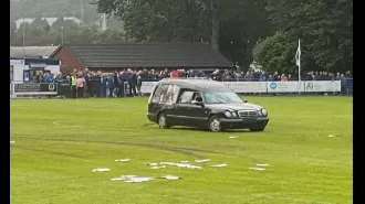 Police are charging a man for disrupting a football game by driving a hearse onto the field.
