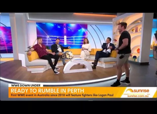 A WWE wrestler gets angry during an interview and threatens to punch the host.