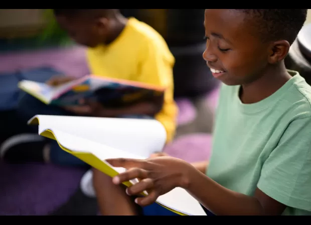 A 6-year-old black boy amazes his community with a remarkably high IQ and advanced reading skills at just 1 year old.