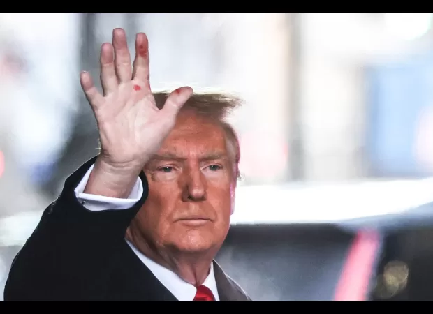 Trump explains reason for odd red marks on his hand.