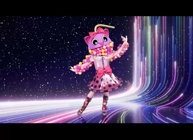 Celebrity judge's TV co-star revealed as hidden contestant on The Masked Singer in surprising twist.