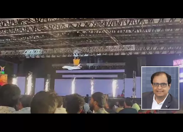 A tech CEO falls to his death on stage when the cage he's in breaks.