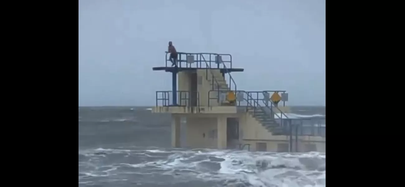 Despite being warned, a diver recklessly enters rough waters caused by Storm Isha.