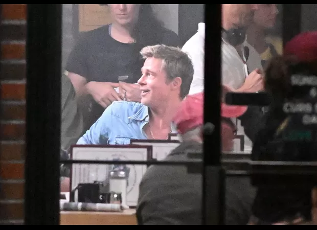 Brad Pitt, aged 60, appears surprisingly young while laughing on the set of a Formula One film.